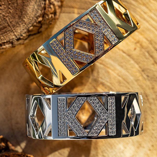 Amp up the glamour with shiny, stacked braceletes. #KARLLAGERFELD