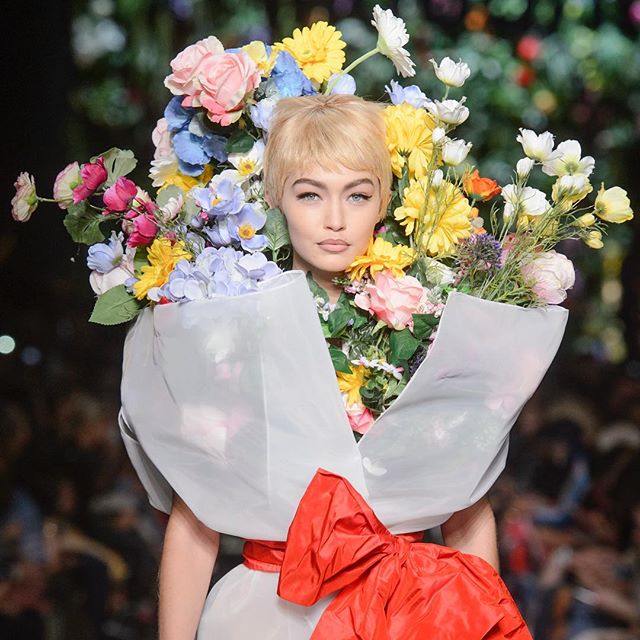 Would you like a bouquet of #GigiHadid today? #Moschino's #JeremyScott presents another whimsical #runway treat #Buro247Singapore