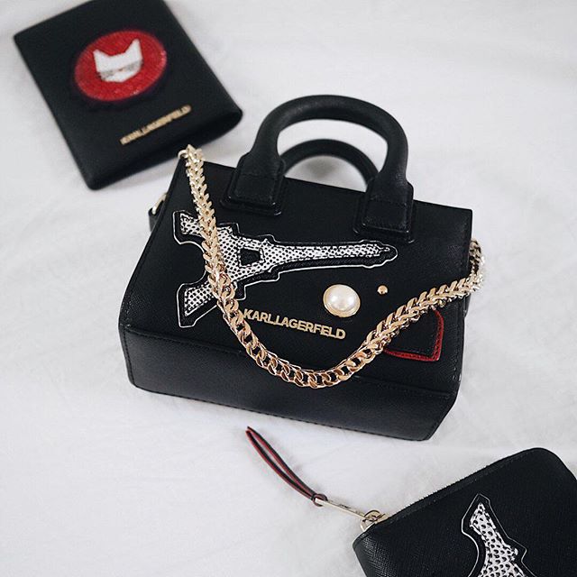 Carry the Eiffel tower   and all of Paris  charms   wherever you go. The whole KARL in Paris collection by clicking the link in the bio. #KARLLAGERFELD.