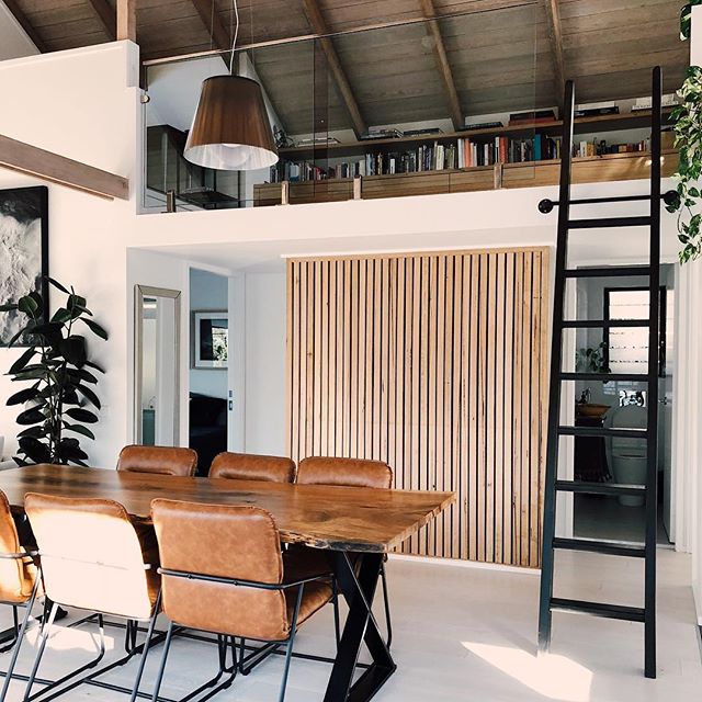 Our forever home with forever pieces. Most of our furniture was custom made because we needed them to fit a specific space. Luke made the ladder and our dining table from a piece of raw wood we found on Gumtree   Our loft library and nearly every other piece of wooden furniture in the house was custom made by @softerstudio. Renovations (including this timber feature wall) was project managed by @altabuild. This isn t a sponsored post at all. We grew up with the owners of both businesses on the Central Coast but bias aside, I honestly cannot recommend them more highly. Thank you team, we are so lucky to have such talented friends and have our home built with love.